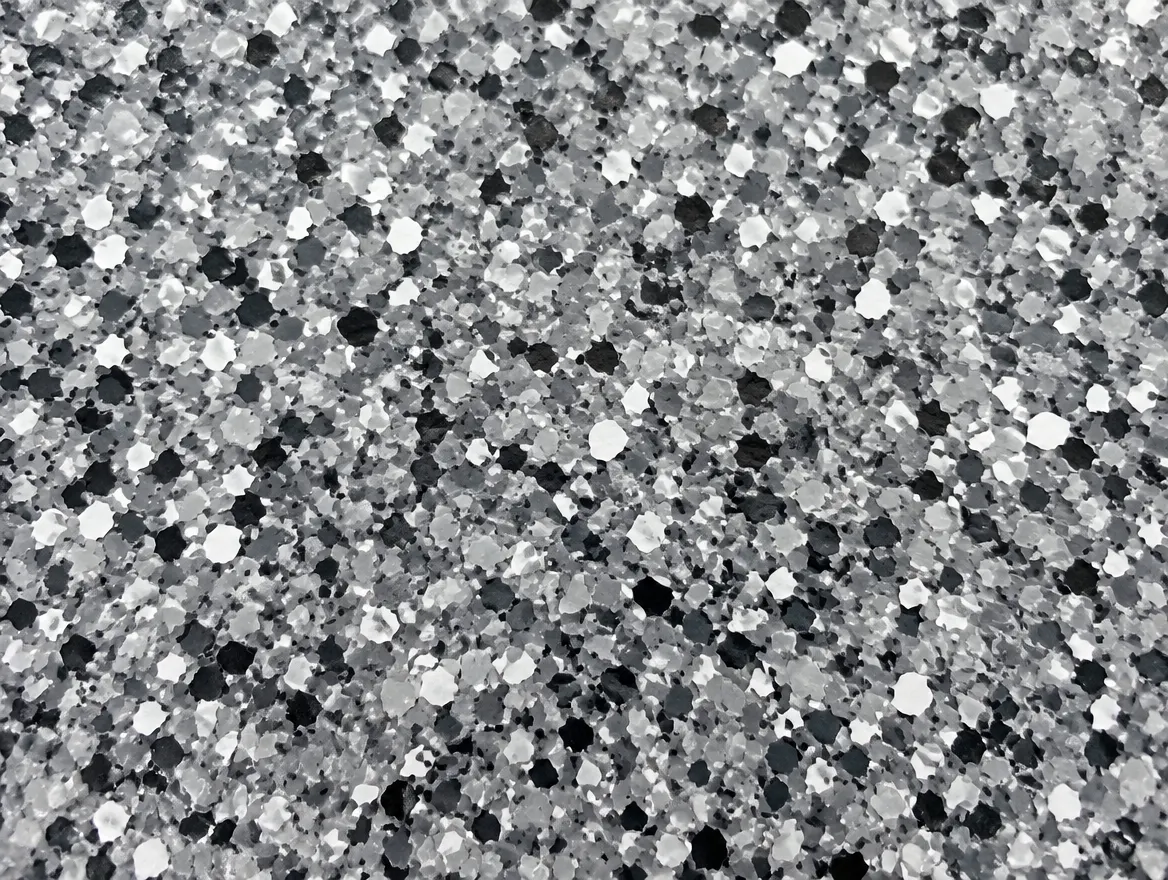 Close-up of a full broadcast flake garage floor coating under a glossy clear topcoat